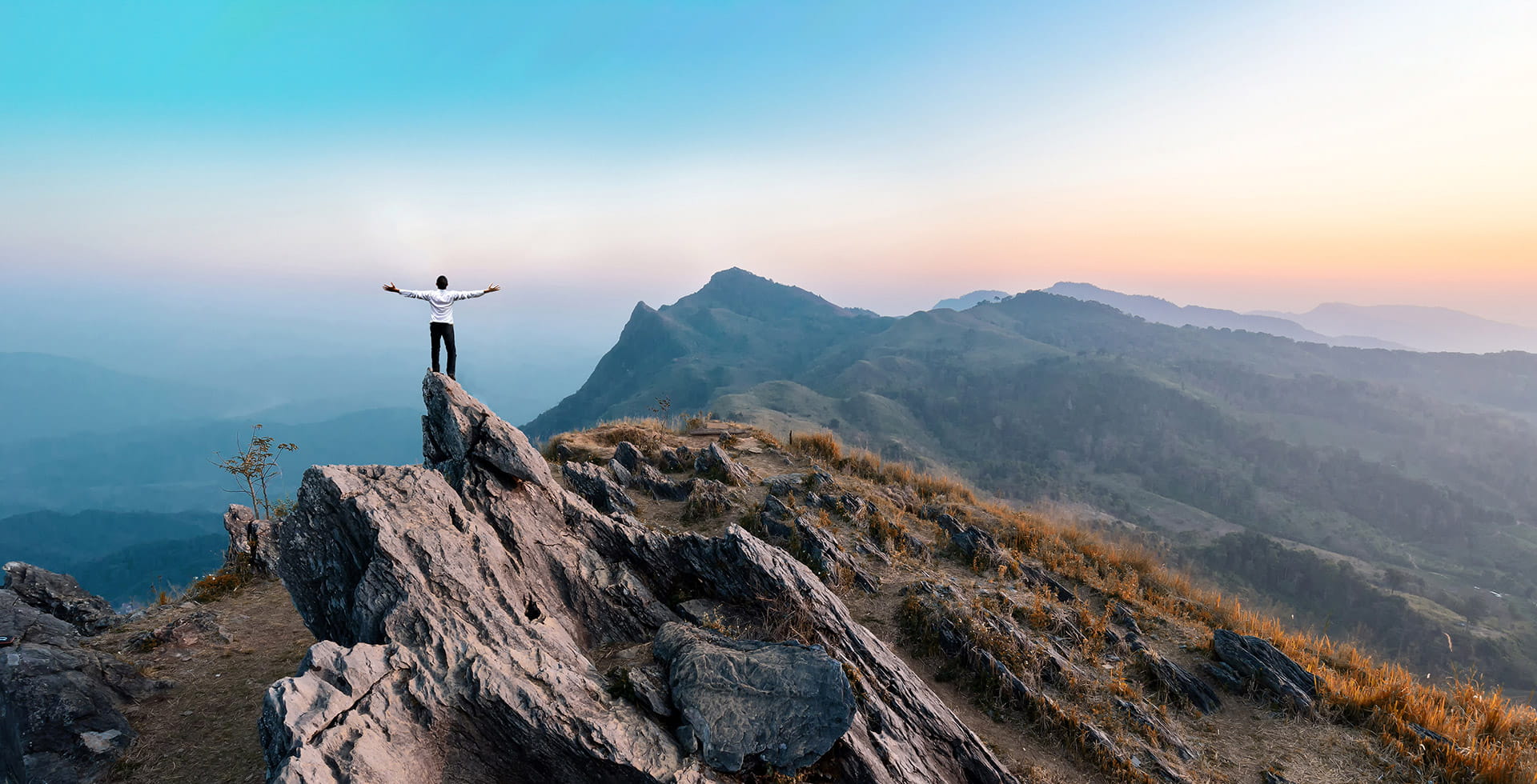 Man on top of the mountain